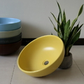 Chậu lavabo đặt bàn sứ tròn màu vàng Kanly SU514